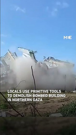 Locals use sledgehammer to dismantle bombed building in northern Gaza