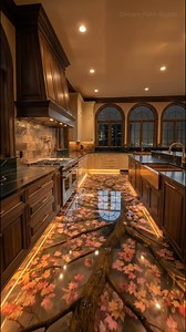 49K views · 781 reactions | Okay THIS is wild… a glowing fall-leaf floor sealed under glass like a frozen moment ✨ The warm underlighting makes it look unreal—luxury meets art gallery. #interiordesign #homedesign #luxurykitchen #kitchendesign #homedecor #resinfloor #epoxyfloor #customdesign #designinspiration #luxuryhomes #lightingdesign #fallvibes #statementfloor #architecturelovers #pinterestworthy #dreamhome #viralhome #wowhome | Dream Path Builds | Facebook