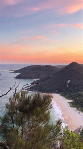 Scope out the surf from the perfect viewpoint 🌊 2.5 hours from Warrane (@Sydney), this ancient volcanic peak serves up a pretty spectacular 360-degree show - prime for checking out which beach to hit in the afternoon. 🎥: @Emma 📍: Mount Tomaree, Port Stephens, @New South Wales #SeeAustralia #ComeAndSayGday #Travel #Australia #Beach ID: Panning video footage showing the view from the top of a mountain overlooking a coastline of golden beaches between towering green peaks.
