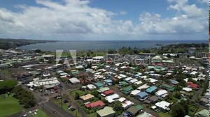 City of Hilo on the Big Island in Hawaii. Dynamic 4K aerial drone video of the island capital city.