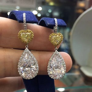 4.2K views · 147 reactions | 10 carats of colorless pear-shaped diamond and 2ct of fancy yellow heart-shaped diamonds #diamondearrings #GIAcertified #diamonds #pearshapediamondearrings | Mike Nekta | Facebook