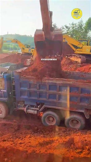 Excavators Load Soil Onto Trucks