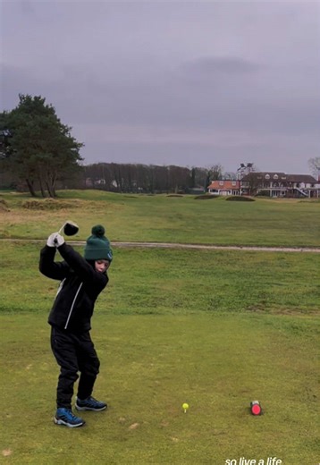 Practicing Golf on a Cold Rainy Day
