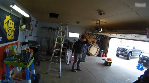 This man on a ladder was taking out Christmas decorations from his garage's attic. Unfortunately, he accidentally fell off the ladder after losing his balance and miserably crashed onto the garage floor. | Jukin Copyright Management | Facebook