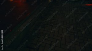 Urban Excitement: Dive into the energy of the city's nightlife with blurry footage capturing the allure of a night club entrance, marked by a striking red door.