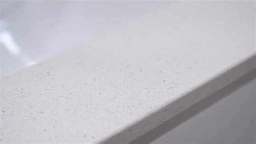 HanStone Tofino is the material featured in this project we completed for this multi-unit community. We supplied over 200 vanity top counters in multiple sizes, and this is just one example of that. | Coastal Quartz Solutions