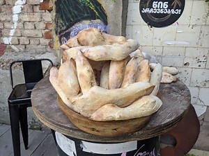 Baking traditional Georgian bread (Tonis Puri)