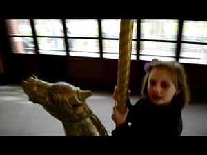 Joanna is riding Prospect Park carousel