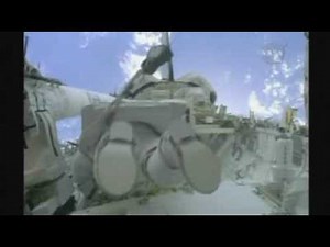 Astronauts make mission's first space walk