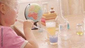 Little girl blows bubbles made of soap foam, bursts, kids fun games, diy soap bubbles, making experiment, child's imagination ignited by wonders science and experimentation