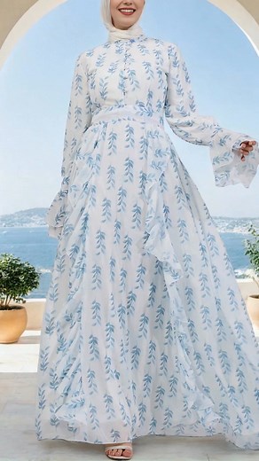 Elegant, modest, and effortlessly graceful — this flowy maxi dress with soft blue leaf prints is perfect for summer days, Eid celebrations, or a serene walk under the sun. Lightweight, breathable, and designed to make you feel beautiful. ✨💙 | Annah Hariri