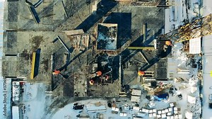 Fast motion of construction specialists at work in a top view