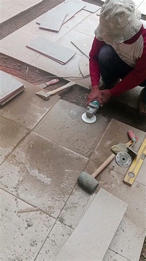 leveling concrete with a concrete sanding machine... for installing ceramic floors