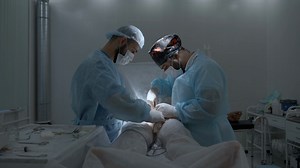 Side View Of Professional Surgeon Wearing Stock Footage SBV-348557625 - Storyblocks