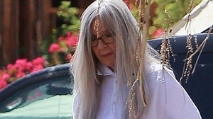 Diane Keaton, 75, is unrecognisable as she wears a long wig to film Mack & Rita