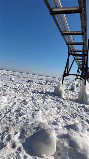 Walking on Ice to a Frozen Lighthouse