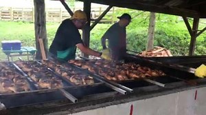 Dinner is being served at the Garrett County Fair. The menu includes chicken BBQ at the Oakland/ Mtn. Lake Park Lions Club pavilion, burgers at the Kitzmiller Lions booth, Knights of Columbus pit beef sandwiches, hot dogs at the Southern High volleyball/ softball booth, Rotary Club french fries, pizza served by the Jr. Women’s Civic Club, chicken wraps at the Northern High Music Boosters’ booth, crab cakes at the Garrett College Athletics’ booth, ice cream served by the Garrett County Farm Burea