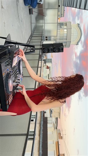 Xenia Frisson on Instagram: "Budapest rooftop. Sunset on fire. And me — turning the city into my dancefloor. No crowd needed, just beats cutting through the evening air, speakers pushing out pure energy. The skyline listens, the sky responds with colors. Red dress, red hair, red mood. Every drop I mix hits harder than the last — this is freedom, this is power, this is my playground. Best vibes. Best view. Best me. Welcome to my rooftop rebellion full version of this set i have it on my Vimeo , l