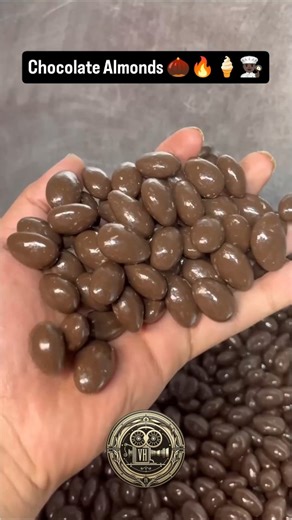 Vibrant Culture Daily on Instagram: "👨🏿‍🍳🌰🔥🍦😎 The process for making commercially produced chocolate-covered almonds is called panning, which creates a thin, uniform, and glossy coating. For home cooks, chocolate-coated almonds can be made with a simpler dipping and setting method. #almonds #Chocolate #usa #desserts #dessert #yum #food #foodphotography #foodlove #food #chocolatecake #choc #chocolat #chocolates ##chocolatelover #chocolatier"