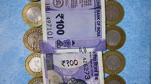 Download 100 Rupee Indian Currency Note with Coins - Slider Shot - Backwards for free