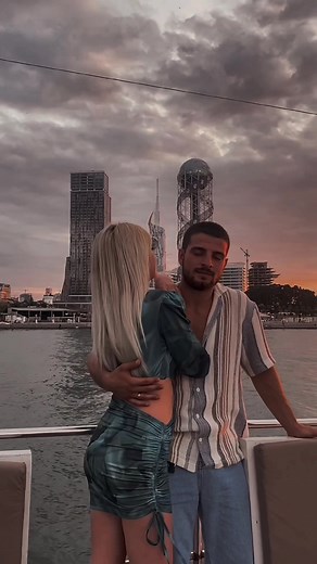 Romantic Moments on a Boat with City Skyline