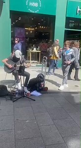 Busker Mick McLoughlin and singer Killian Keating joined forces on Henry Street earlier today for this stunning rendition of the Aslan classic 'Crazy World' in tribute to the band's frontman Christy Dignam. A fitting tribute to the iconic Dublin singer | Dublin Live