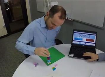 Fastest Time To Stack 20 Lego Bricks In A Right-Angle Pattern Tower With One Hand