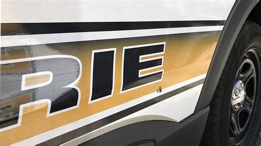 Police say robbery suspects who shot at troopers are at large, considered armed and dangerous