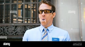 USA. Ryan Reynolds in a scene from the ©20th Century Fox new movie: Free Guy (2020).  Plot: A bank teller discovers that he's actually an NPC inside a brutal, open world video game.  Ref: LMK110-J6831-061020 Supplied by LMKMEDIA. Editorial Only. Landmark Media is not the copyright owner of these Film or TV stills but provides a service only for recognised Media outlets. pictures@lmkmedia.com Stock Photo - Alamy