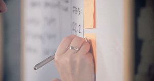 Woman Writing Notes On Sticky Notes Stock Footage SBV-333093039 - Storyblocks