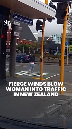 671K views · 1.8K reactions | A woman in Wellington was thrust into traffic on Oct 21 by deadly winds. Australia and New Zealand are bracing for strong winds and extreme heat. The authorities said people should stay indoors, avoid travel and prepare for possible power and communications outages. https://str.sg/CgLh | The Straits Times | Facebook