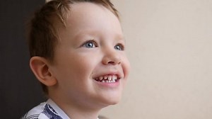 Close-up of a face of a happy smiling boy