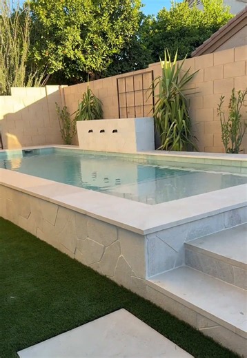 Raised Stacked-Stone Pool with Three-Scupper Water Wall