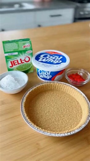 No-Bake Grinch Jello Cool Whip Cheesecake Festive No-Bake Grinch Green Jello Cool Whip Cheesecake Delight Ingredients: 1 ½ cups crushed Golden Oreos or graham crackers 6 tablespoons unsalted butter, melted 8 oz cream cheese, softened 1 cup Cool Whip, thawed 1/3 cup powdered sugar 1 teaspoon vanilla extract 1 (3 oz) box lime or green apple Jell-O 1 cup hot water Green gel food coloring (optional, for brighter color) Red heart sprinkles or holiday decorations (optional, for topping) Directions: In