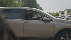 Daughter Getting Out of the Car at School Drop Off During the Day