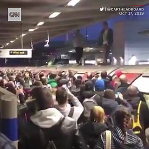 Angry commuters clashed with climate protesters at peak rush hour in London this morning. Video shows crowds shouting at protesters who'd climbed on top of trains, throwing objects and dragging them down to the platform: https://cnn.it/2Mk2yZ8 | CNN