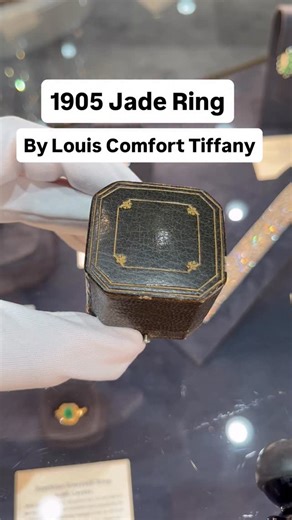 M.S. Rau Jewels on Instagram: "Circa 1905 ✨ This extraordinary ring by Louis Comfort Tiffany for Tiffany & Co. showcases a substantial jade cabochon of approximately 7.45 carats. Certified by the American Gemological Laboratories as Type A, the vibrant green jade is surrounded by striking geometric bands of blue and green enamel work that exemplify Tiffany’s mastery of color and his revolutionary approach to American Art Nouveau jewelry. Set in 14K yellow gold. View our website for more info. It