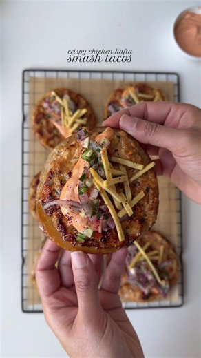 Crispy Chicken kafta smash tacos 🌮 Ingredients For the chicken: 1 lb boneless chicken thighs, minced 1 large yellow onion, finely grated and excess water squeezed out 4 garlic cloves, finely grated 1 tbsp parsley, chopped Salt to taste 1 tsp smoked paprika powder 1/2 tsp chili powder 1/2 tsp ground coriander 1 tsp cumin powder 1 tbsp garlic powder For the salad: 1 red onion, diced 2 tomatoes, seeded and diced 1 cucumber, diced 1 tbsp fresh parsley, chopped Squeeze of lemon juice Salt to taste 1