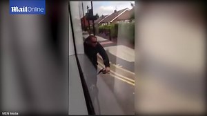 Crazy moment dangerous cyclist hitches ride on Manchester tram