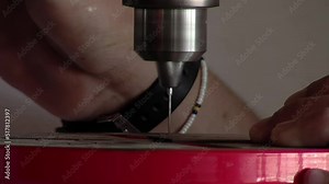 Hands of an Inmate Using Bench Drill Press in Workshop at Prison. Close Up.