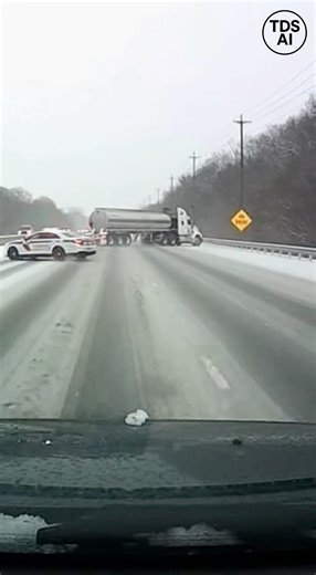 Police Cruiser Slides Into Tanker on Icy Highway, Sending Truck Over Guardrail Dash camera footage captures a dangerous chain reaction on an ice-covered highway in Cheyenne, Wyoming, when a police cruiser loses traction and slides into the rear of a tanker truck during hazardous winter conditions. Moments after impact, the tanker begins to fishtail across multiple lanes, struggling to regain control on the slick roadway. The video shows the tanker drifting uncontrollably before sliding through t