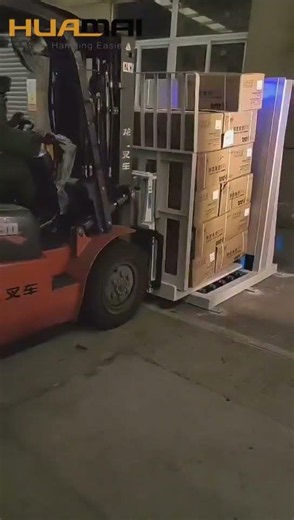 Stationary Pallet Remover Transferring goods from pallet to bag load pusher