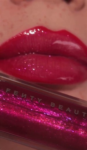 FENTY BEAUTY BY RIHANNA on Instagram: "Fuchsia Flex 4ever 💖 Gloss Bomb Universal Lip Luminizer in 'Fuchsia Flex' is a shimmering holographic deep fuchsia & the ultimate bad gal coded lip gloss 💅🏽💅🏿💅🏻 One luscious swipe of Gloss Bomb gives lips more to love with Peptides, Shea Butter + Vitamin E nourishing from within & strengthening your lips’ moisture barrier ✨ @olgadann wears Gloss Bomb in ‘Fuchsia Flex' paired with Trace'd Out Pencil Lip Liner in 'The MVP' 💋 Cop this Fenty lip combo a