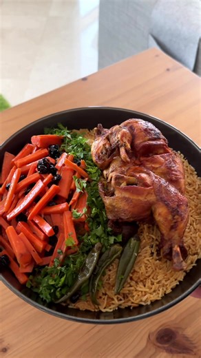 Saudi Chicken Bukhari * 1 kg whole chicken with skin cut into two pieces * 2 tbsp oil * 1/4 cup ghee * 2 carrots, thinly sliced * 1/2 cup black raisins (soaked) * 5 cardamom * 2 bay leaves (optional) * 1 cinnamon stick * 3 dried lemons * 2 onion, chopped * 1 tbsp ginger garlic paste * 1 tsp coriander powder * 1 tsp cumin powder * 3/4 tsp black pepper powder * 2.5 tsp Arabic masala * 1 maggi chicken stock cube (less salt) (optional) * 1 and half tsp garam masala (optional) * salt as needed * 2 to