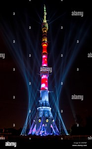 International Festival "Circle of Light". Laser video mapping show on Ostankino TV tower in Moscow, Russia. 3D projection mapping on building and firework show Stock Photo - Alamy