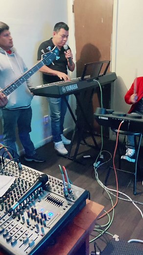 Indoor Musical Performance with Keyboard and Bass Guitar