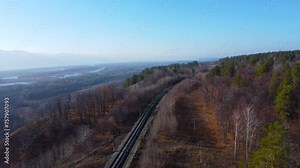 Railway in the forest autumn view from a drone. Empty Railway. Concept of nature forest preservation and reforestation. Harmony Calm Relaxation. Save Earth Green Planet