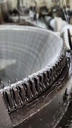 Real Engineerings | Engineering & Technology & Gadgets & DIY on Instagram: "Industrial Textiles: The Mesmerizing Dance of Circular Knitting! 🧵⚙️ ​Observe the hypnotic synchronization of modern textile manufacturing! This video gives a close-up view of an industrial circular knitting machine, the workhouse behind the seamless tubular fabrics used for countless t-shirts, socks, and athletic wear garments globally. ​The Science of Loop Formation ​This process converts a single strand of yarn into