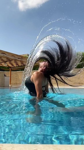 Vibrant Pool Day: Hair Flip and Splash Fun