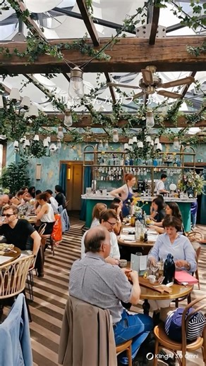 📸 [Paris] Reservations are a must! A stunning Italian restaurant with a high ceiling and plants r...